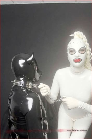 Rubber pig slave in submission to his mistress